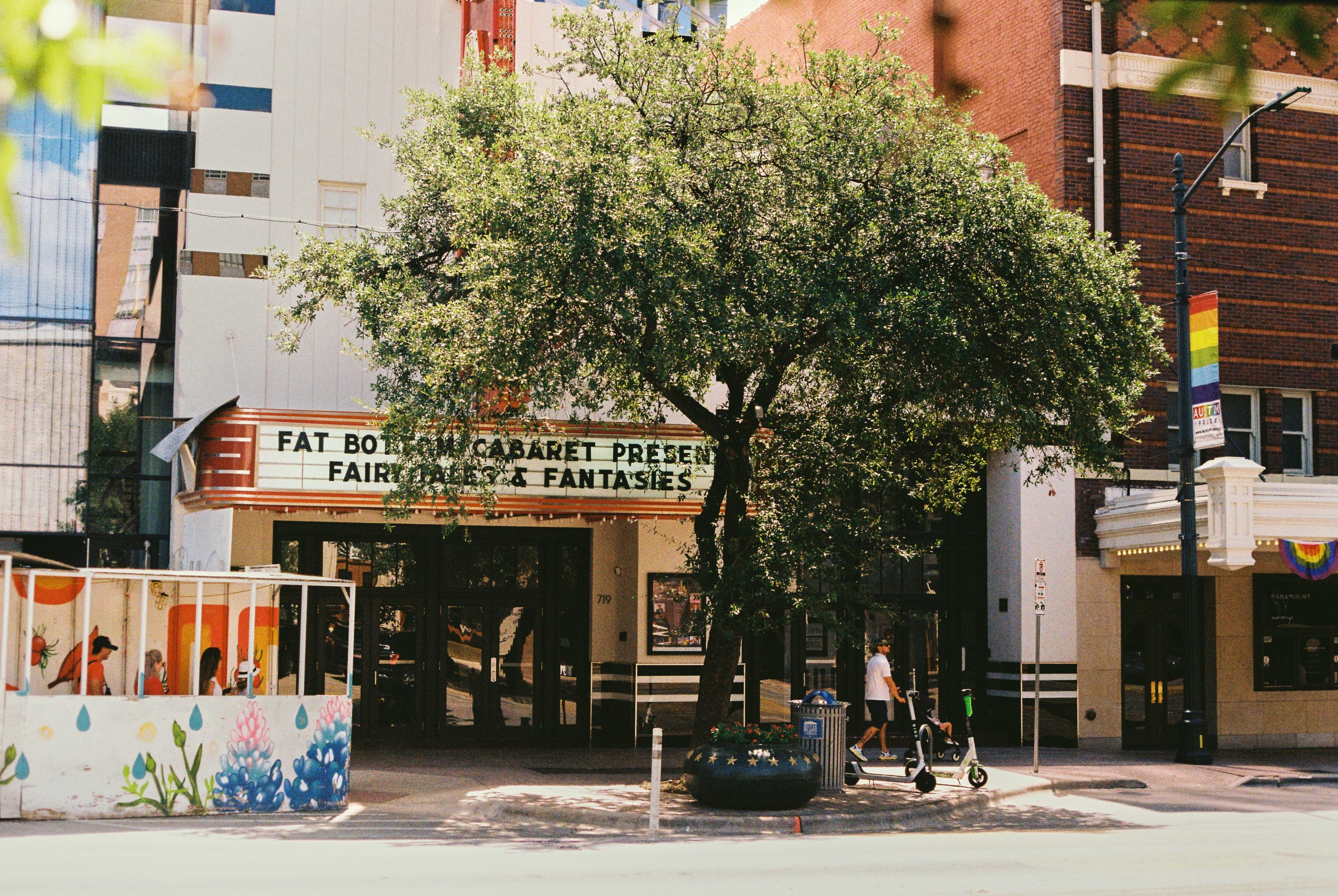 Street view of a small theater with a marquee