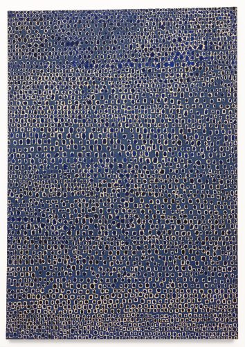 A large abstract painting composed of thousands of small, hand-painted indigo blue dots and rectangular enclosures tightly arranged in repeating horizontal rows across a lighter canvas background.